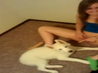 Kinky babe enjoying dog oral sex on the floor